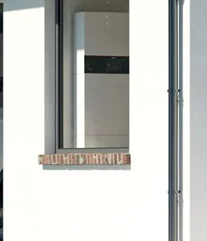 Modernes Haus mit Wärmepumpe von Viessman im Außenbereich.